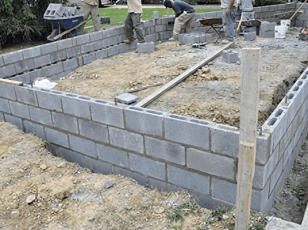 Professionals building a foundation with blocks in Fargo, ND